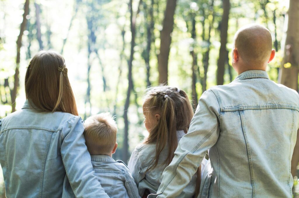 Family sitting in the forrest